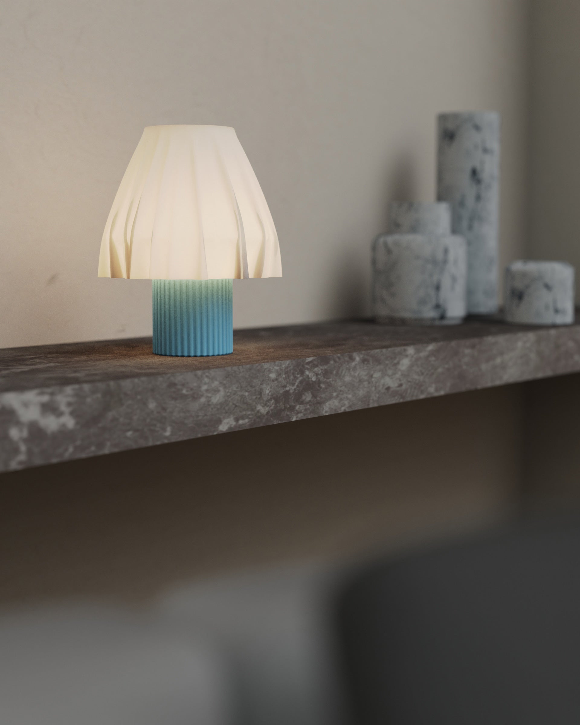 The Volute - Azur table lamp by Mouchoir, featuring a digital craft design mimicking frozen silk fabric on a marble surface.
