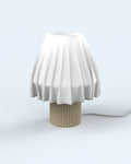 The Volute - Solar table lamp by Mouchoir, featuring a digital craft design mimicking frozen silk fabric.
