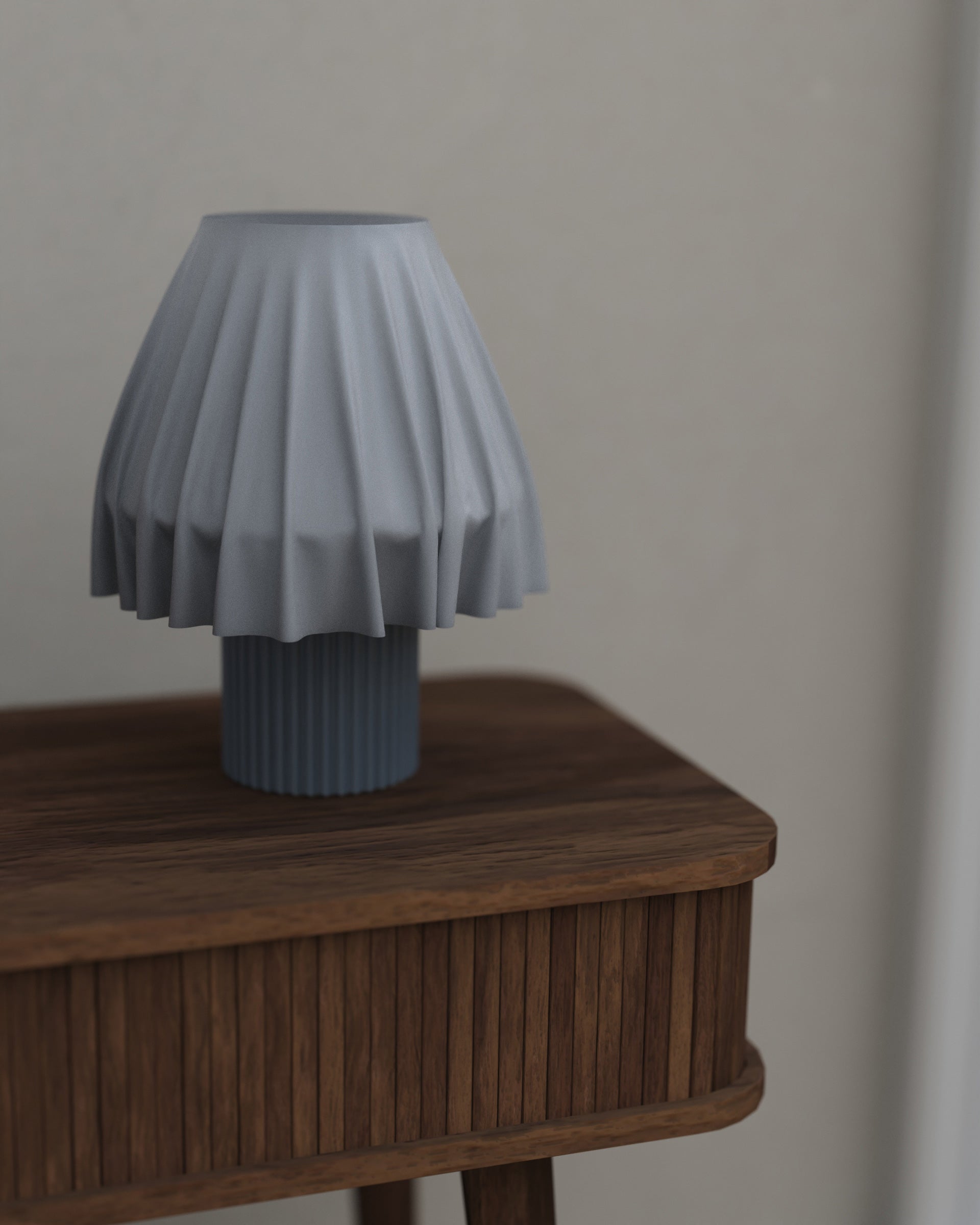 The Volute - Graphite table lamp by Mouchoir, featuring a digital craft design mimicking frozen silk fabric on a wooden table.