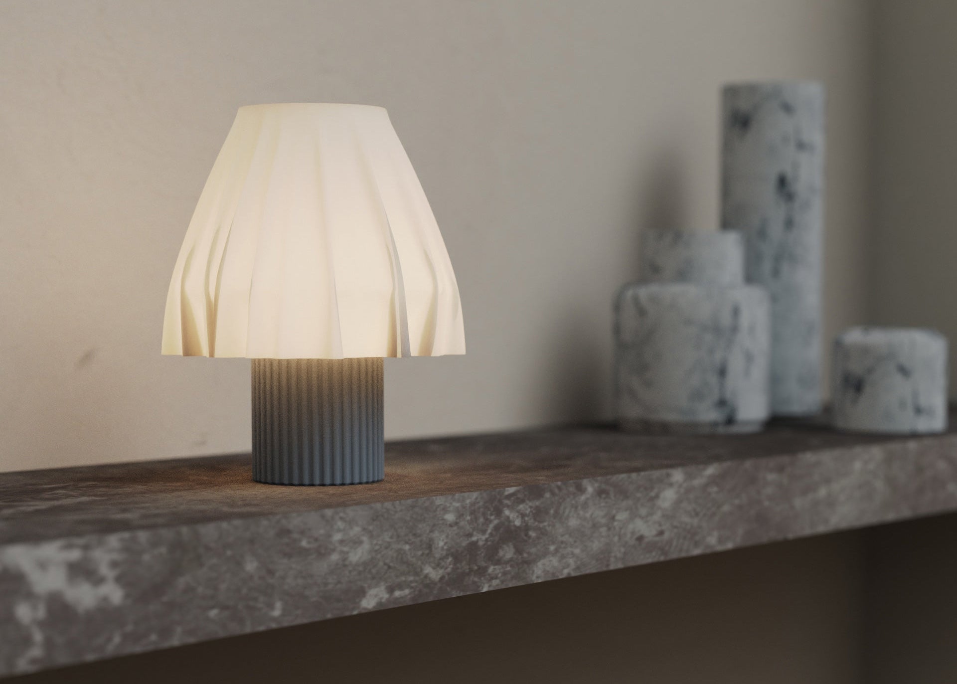 The Volute - Graphite table lamp by Mouchoir, featuring a digital craft design mimicking frozen silk fabric on a marble table.