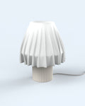 The Volute - Ivory table lamp by Mouchoir, featuring a digital craft design mimicking frozen silk fabric.